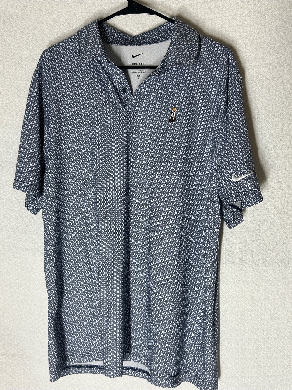 Nike Men's Light Blue Patterned Polo with Embroidered Golfer Logo